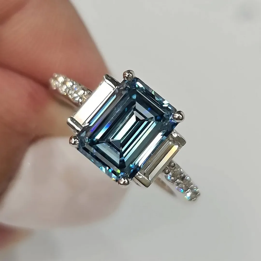 /public/photos/live/Blue Emerald Cut Moissanite Three Stone Engagement Ring 610 (4).webp
